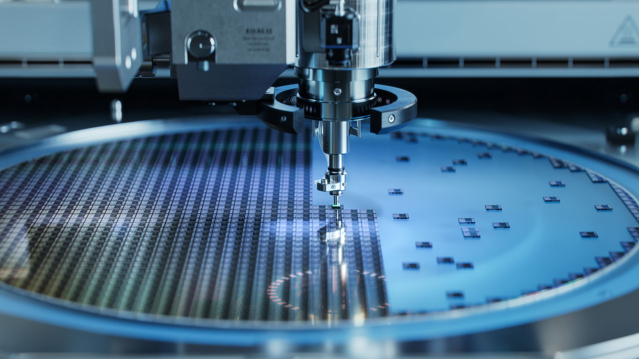 Automated pick-and-place tool separating individual chips from a silicon wafer